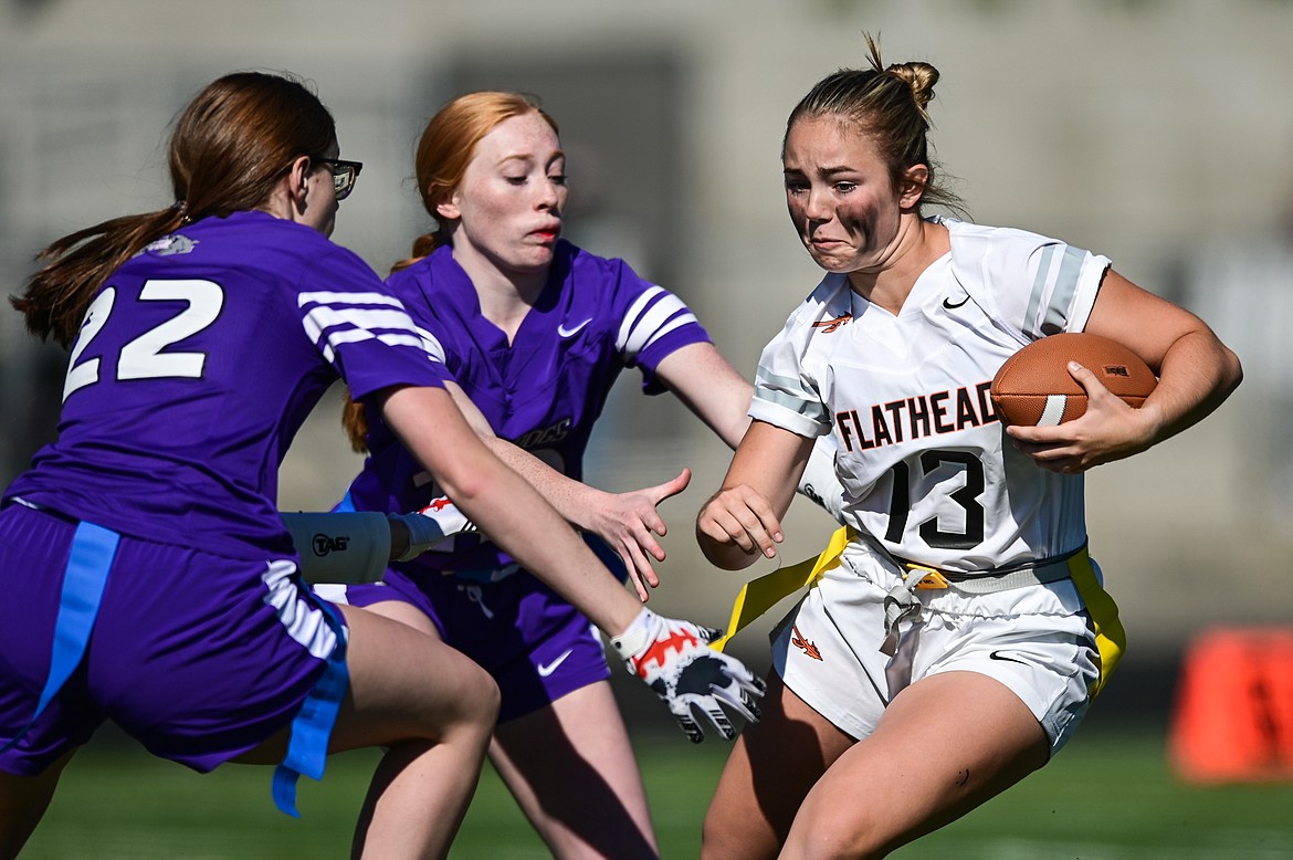 Flathead's Quinlenn Tennison (13) picks up yardage after a reception against Butte at Legends Stadium on Saturday, Sept. 10. (Casey Kreider/Daily Inter Lake)