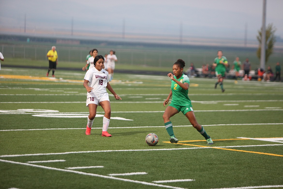 Quincy defender Joceline Schaapman swipes in to break up a Wahluke breakaway.