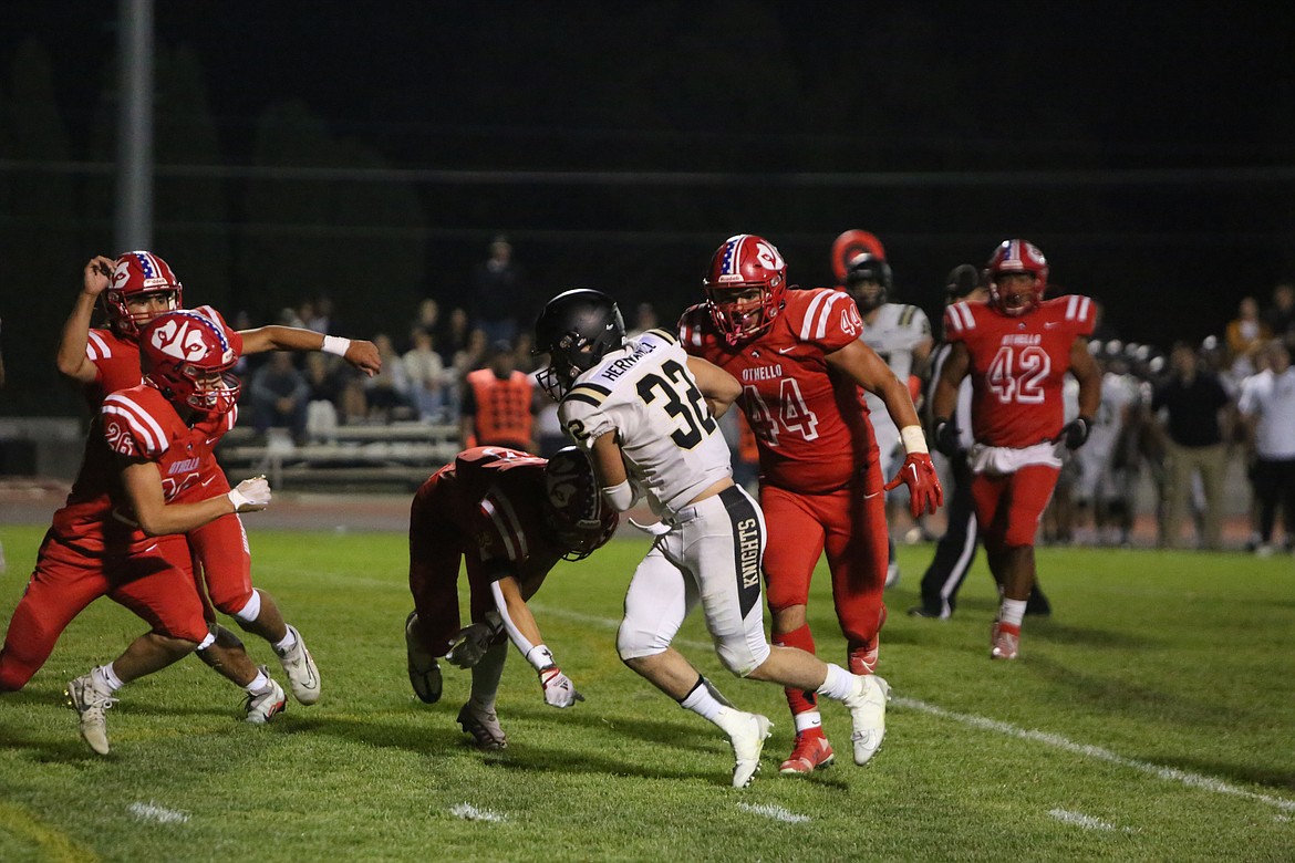 Royal running back Kaleb Hernandez fights for extra yardage in the red zone.