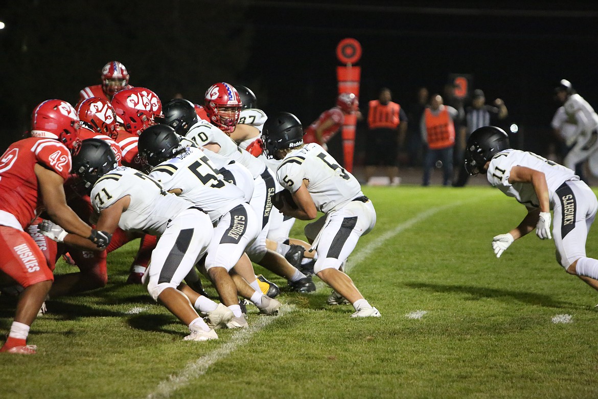 Royal quarterback Dylan Allred runs a quarterback sneak for a four-yard touchdown in the third quarter of Royal’s 14-0 win over Othello.