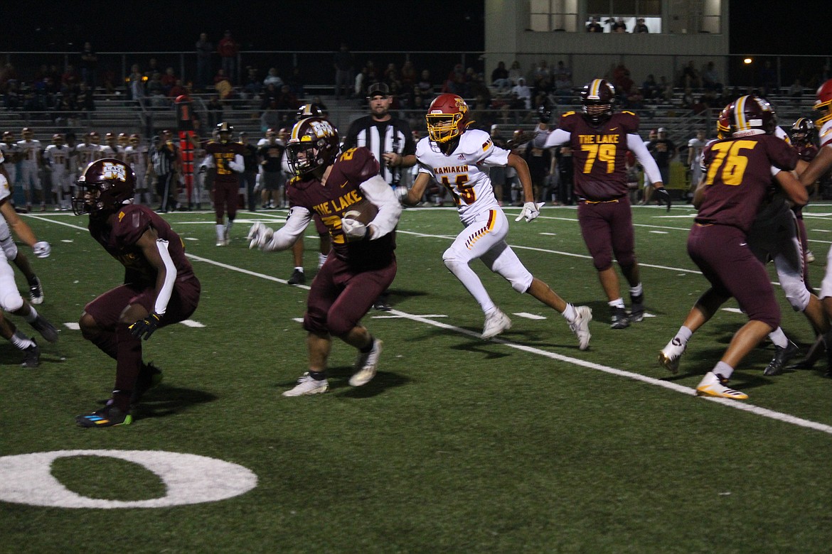 Moses Lake running back Jonah Robertson (22) works his way through the defense during the Mavericks’ 36-29 loss to Kamiakin Friday.