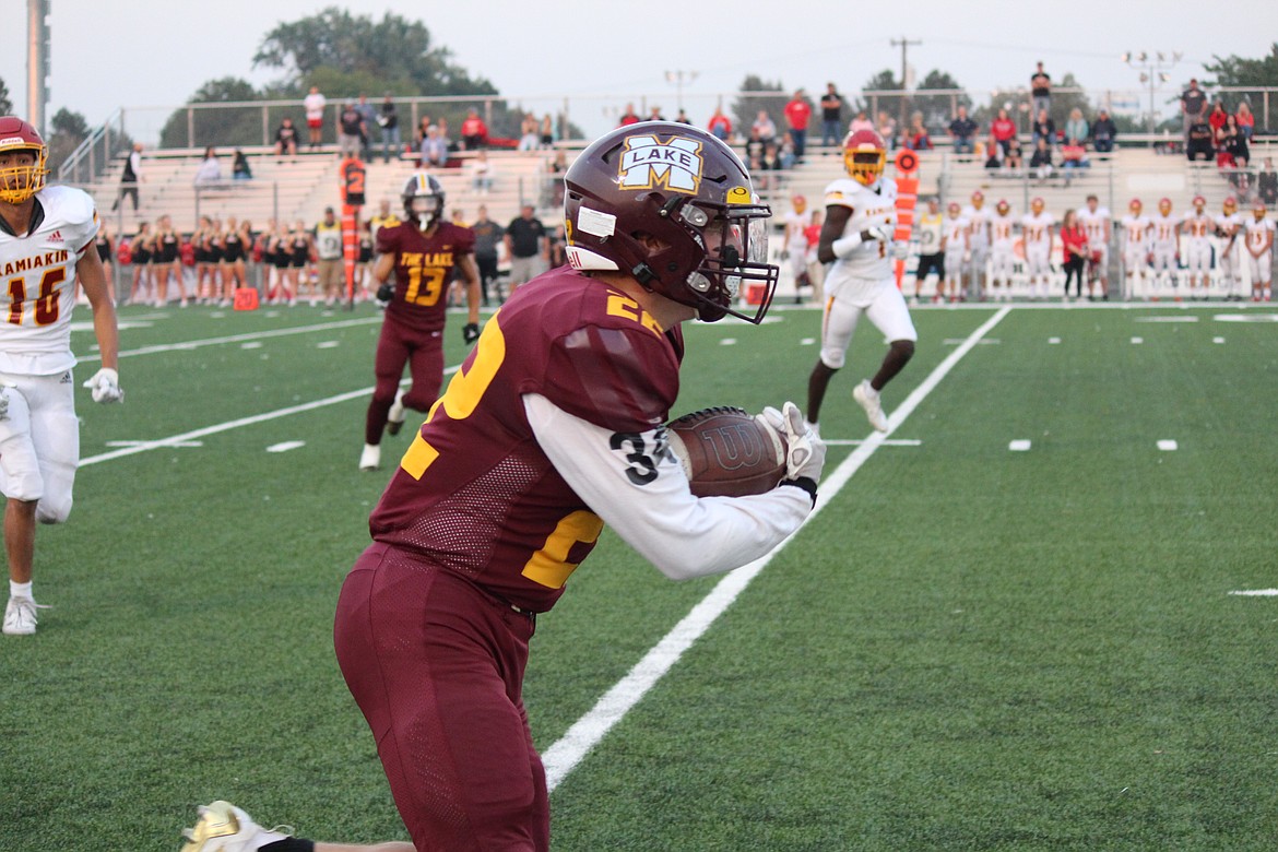 Moses Lake running back Jonah Robertson (22) takes the ball upfield in the first half.