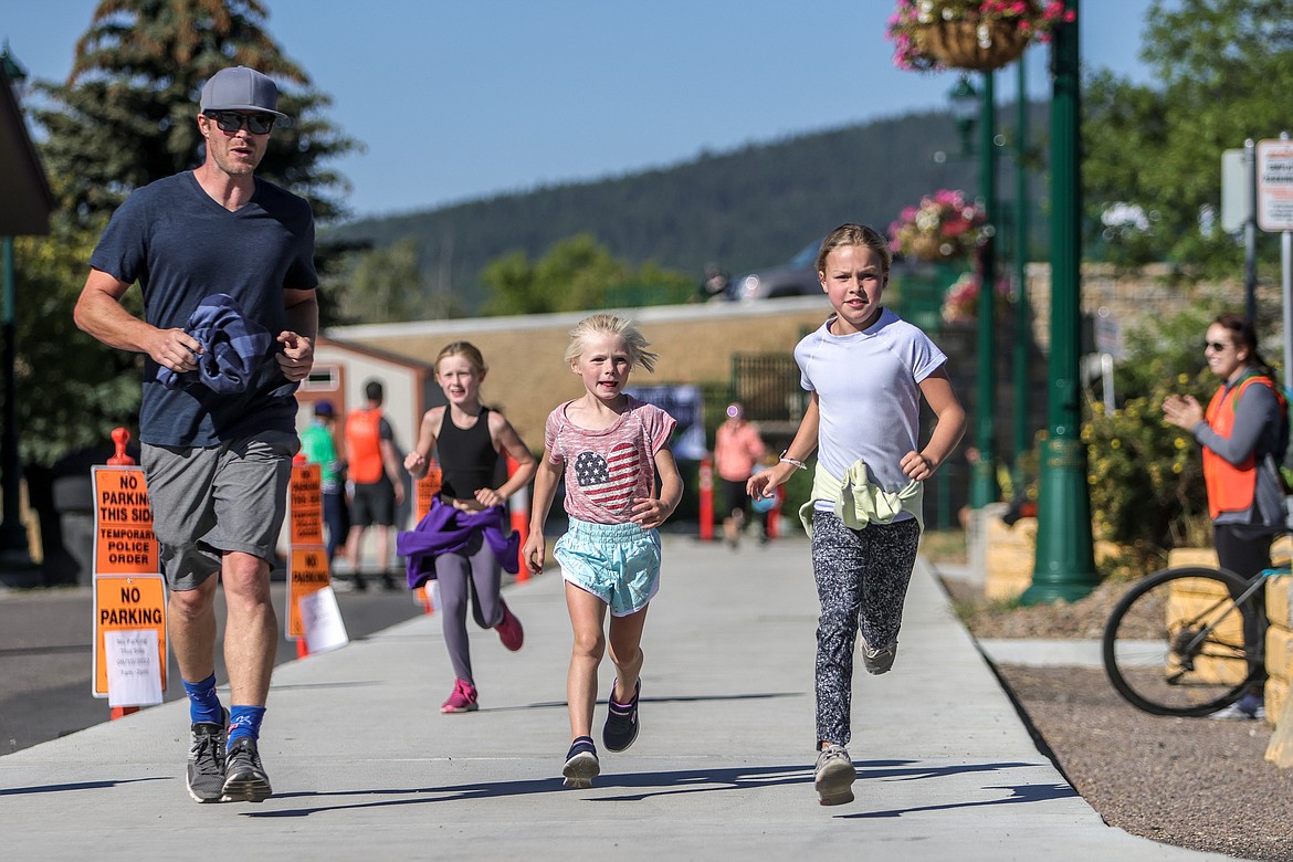 Ross, Scout and Vale Foster and Ryan Brothers compete in the Great Fish Fun Run recreational race at Depot Park on Saturday. (JP Edge photo)