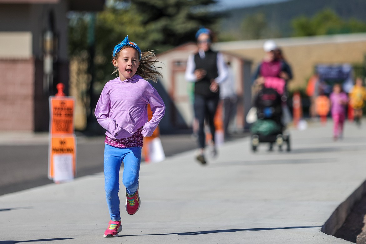 Evelyn Reger with a strong finish at the Great Fish Fun Run's recreational race. (JP Edge photo)