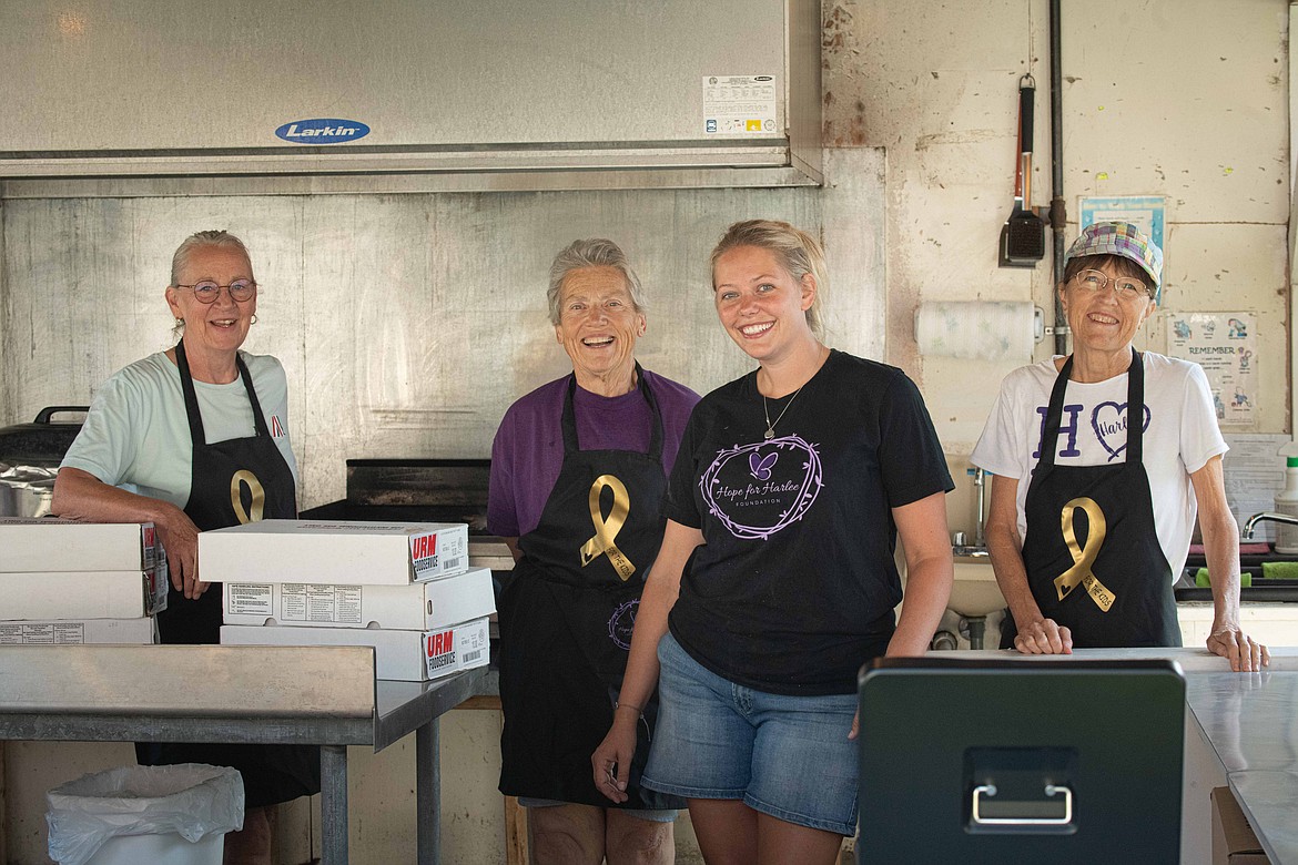 Volunteers with Hope for Harlee, a local nonprofit that raises funds for pediatric cancer, at the Sanders County Fair. (Tracy Scott/Valley Press)