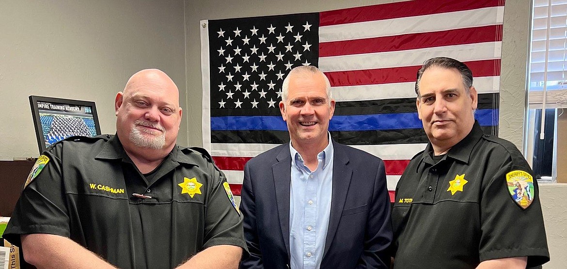 U.S. Rep. Matt Rosendale, R-Montana, visits with Mineral County Sheriff Mike Toth, right, and Undersheriff Wayne Cashman on a trip through Superior last Tuesday.