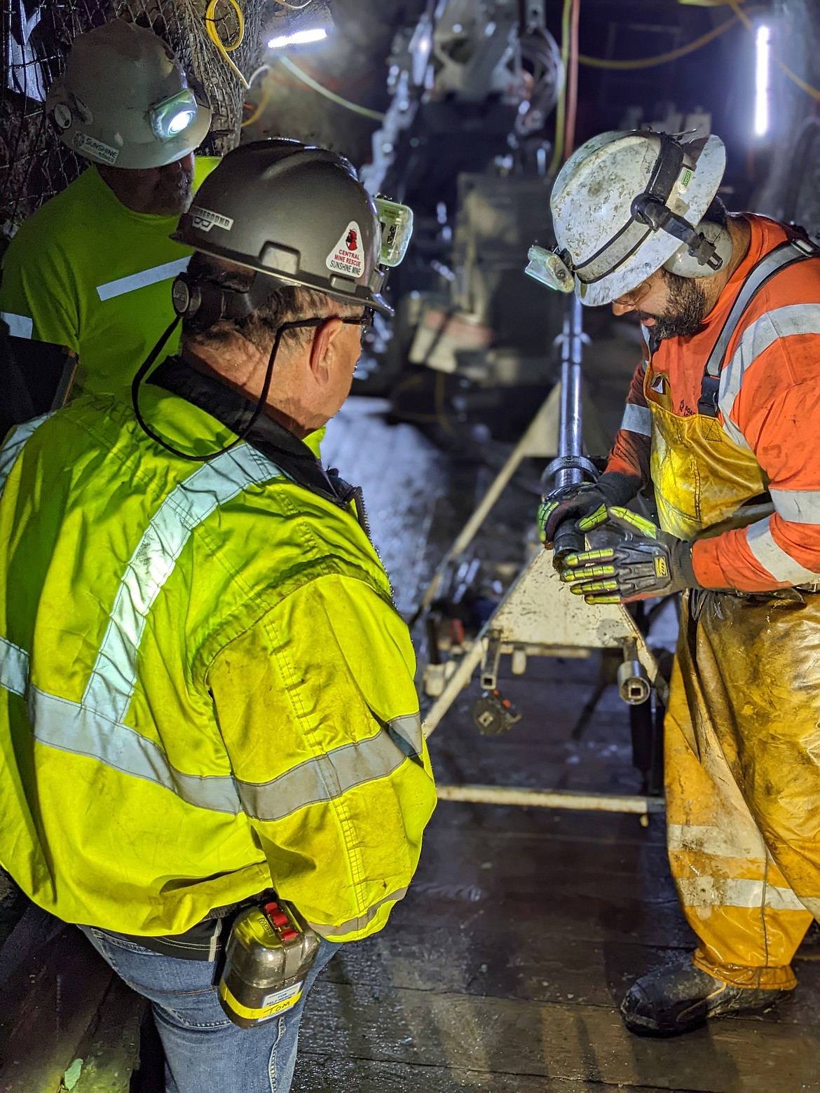 Geology Manager Greg Nickel and Mine General Manager Tom Henderson observe Boart driller Andrew Minner prepare a new drill tube for the LM110.