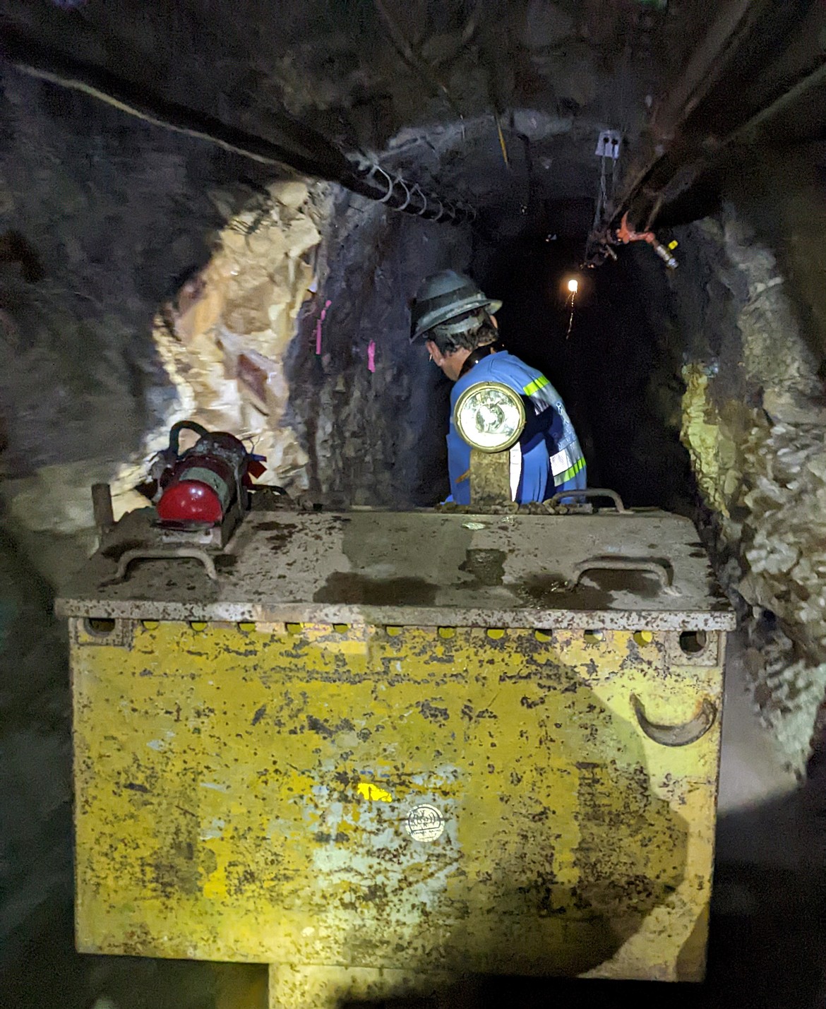 Sunshine Mine General Foreman Justin Wilbur operates a mine cart toward the exit of the Con-Sil Tunnel.