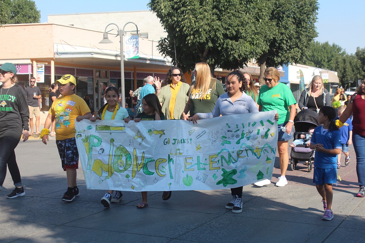 Pioneer Elementary students made a sign and carried it down the Farmer Consumer Awareness Day parade route.
