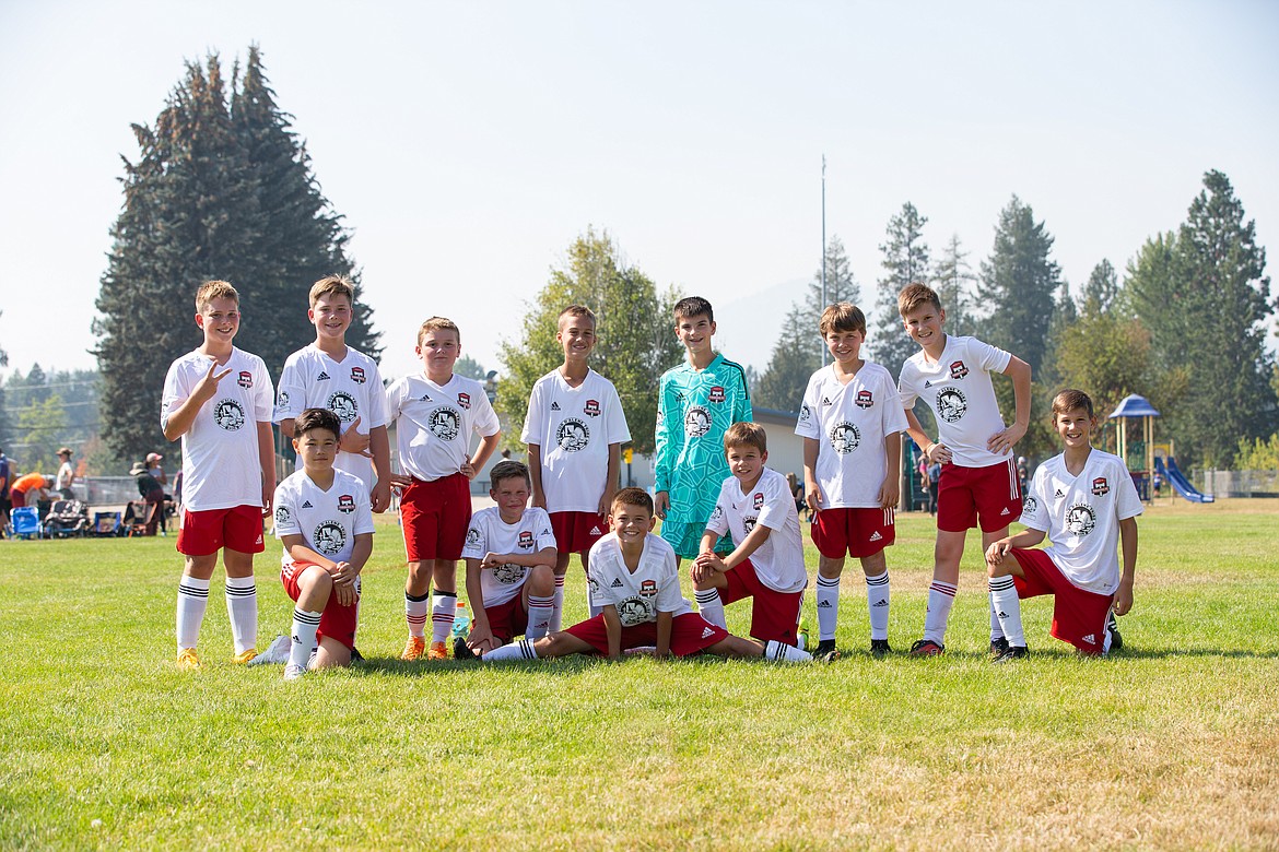 Photo by BUSCEMA PHOTOGRAPHY
The Timbers North FC 11 boys soccer team went 2-1 at the Pend Orielle Cup in Sandpoint last weekend. The Timbers played Missoula Surf 2011B, Spokane Sounders B2011 South Rave and 90+ Project B11 Hartanov-Valdez. Timbers goals were scored by Lucas Buscema, Charlie McVey, Ryder Quinn, Owen Newby, with assists by Ryder Quinn, Asher Smith, Kashton Pintler and Lucas Buscema. Damon Mysse played goalkeeper and had multiple saves. From left are Asher Smith, Landon Smith, Eli Vatsvog, Kashton Pintler, Owen Newby, Ryder Quinn, Ryder Benca, Damon Mysse, Charlie McVey, Oliver Peters, Max Lopez and Lucas Buscema.