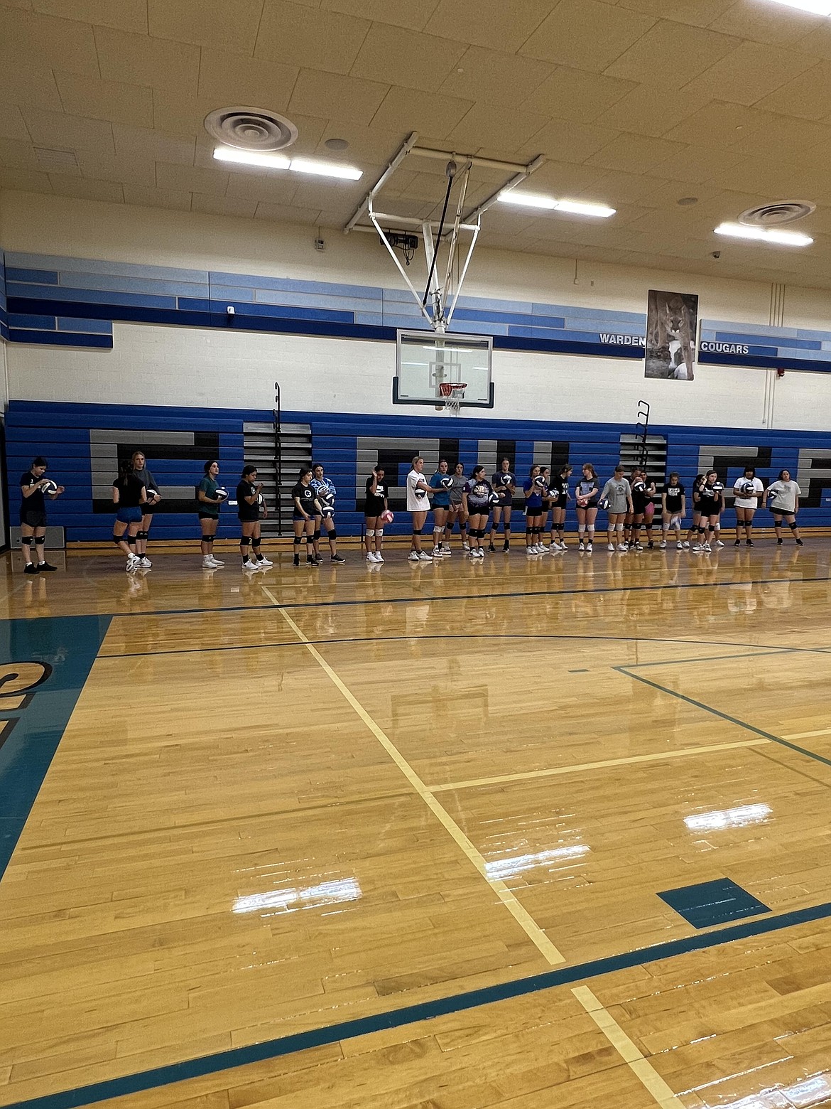 Warden volleyball players line up during practice. Head coach Shanna Golladay said the Cougars have been working on energy during practices, which she says will help them keep a winning attitude on the court during games.