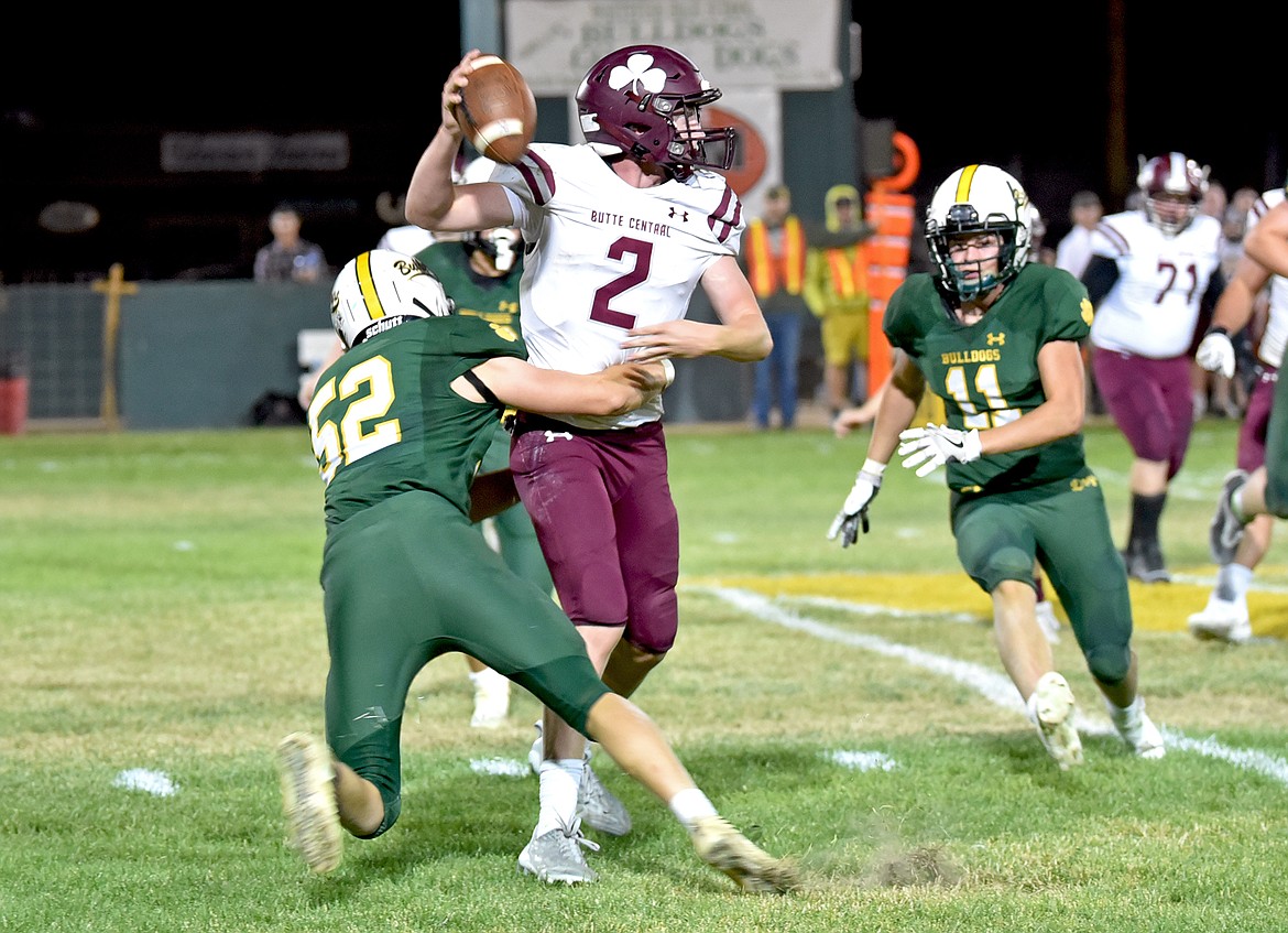 Whitefish's Henry Bennetts (52) breaks through the line for a sack on Butte Central quarterback Jack Keeley in a game on Friday in Whitefish. (Whitney England/Whitefish Pilot)