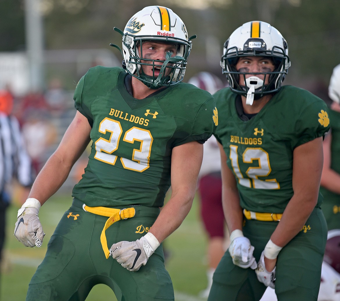Whitefish players Ty Schwaiger and Luke Moses celebrate a big defensive play in a game against Butte Central on Friday in Whitefish. (Whitney England/Whitefish Pilot)