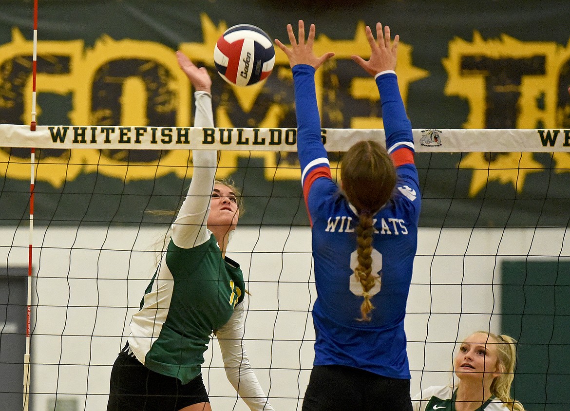 Whitefish's Nayvee Miller spikes the ball over the net in a match against Columbia Falls on Thursday in Whitefish. (Whitney England/Whitefish Pilot)