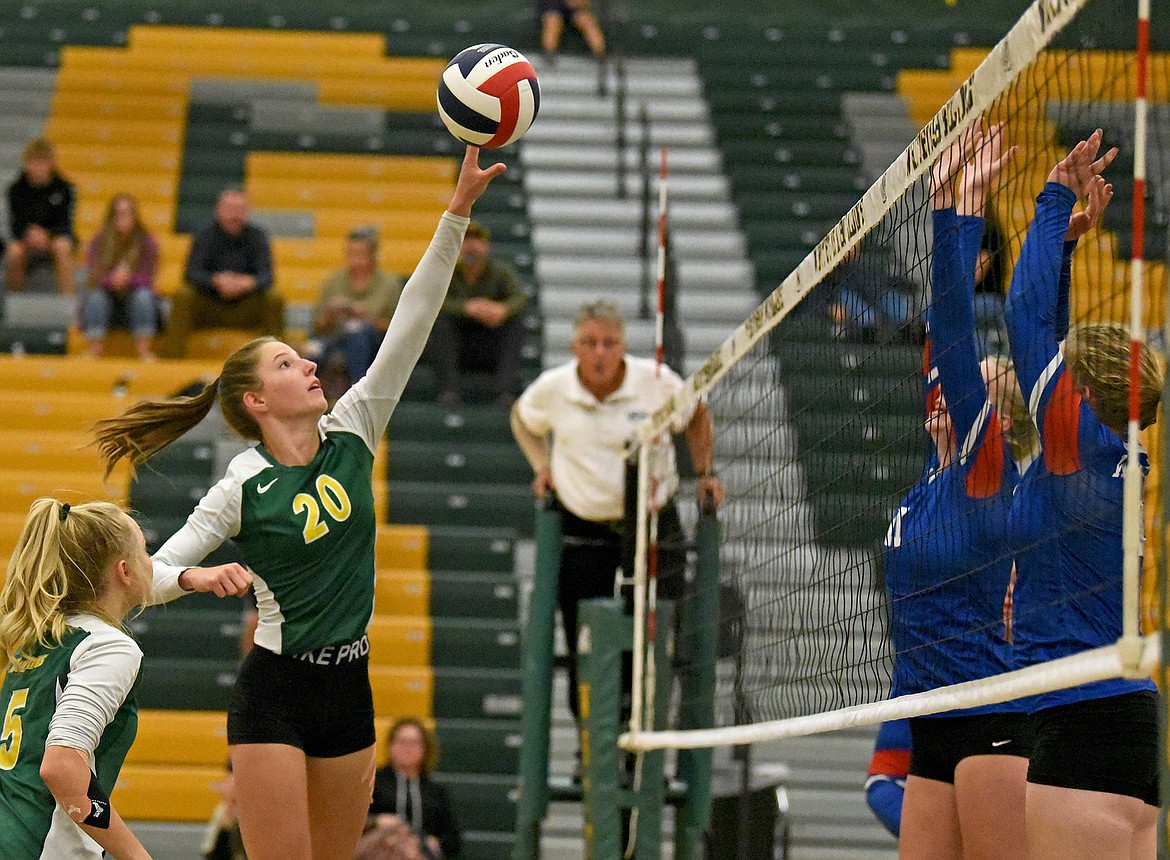 Whitefish's Hailey Ells looks to hit the ball back over the net in a match against the Wildkats on Thursday. (Whitney England/Whitefish Pilot)