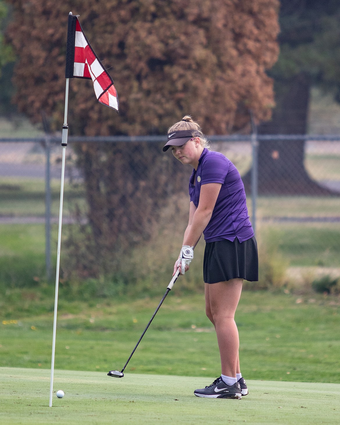 Polson Lady Pirate Ashley Maki sinks her putt on the 11th hole.
(Lake County Leader file photo)