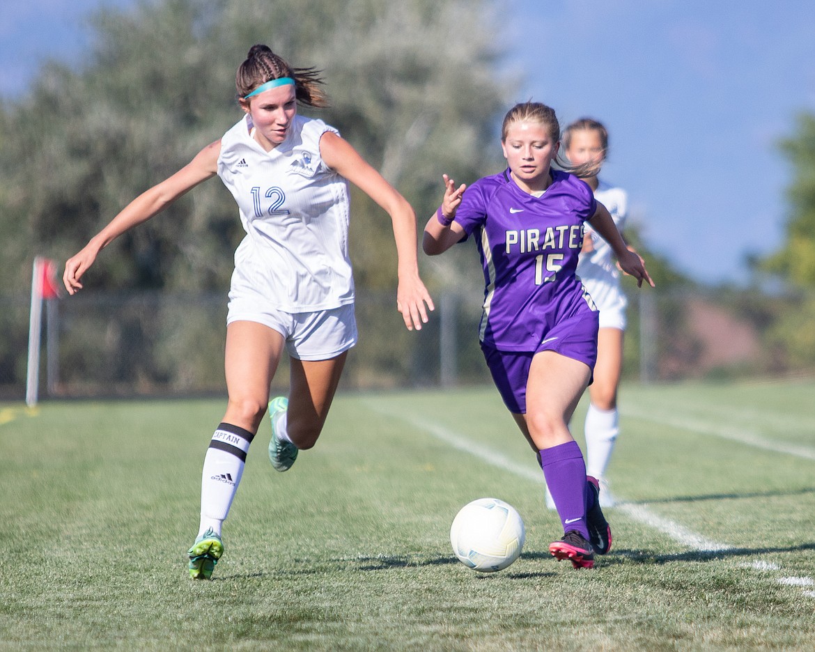 Lady Pirate Felicity Mihara battles for the ball.
(Rob Zolman/Lake County Leader)
