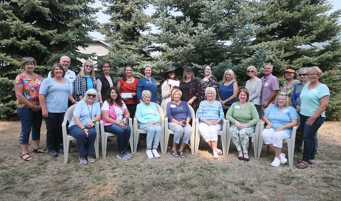 The Coeur d'Alene Garden Club on Tuesday presented 11 local nonprofits with funds raised during the 2022 Garden Tour. This year's event raised more than $12,000. From left, standing: Tina Hood, Roberta McKinney, Kurt Neely, Pamela Noah, Vicky Nelson, Vanessa Moos, Sally Wynn, Tiffinay Walker, Becky Georgious, Jessica Gross, Kristen Nesser, Gigi Grant, Bill Griffiths, Sandy Armand, Dianne Lipscomb and Vickie Davison-Best. Seated, from left: Linda Juergensen, Jill Marfice, Bonnie Warwick, Cathy Evjen, Kathie Strinz, Marge Hoyt and Cheryl Sorenson.