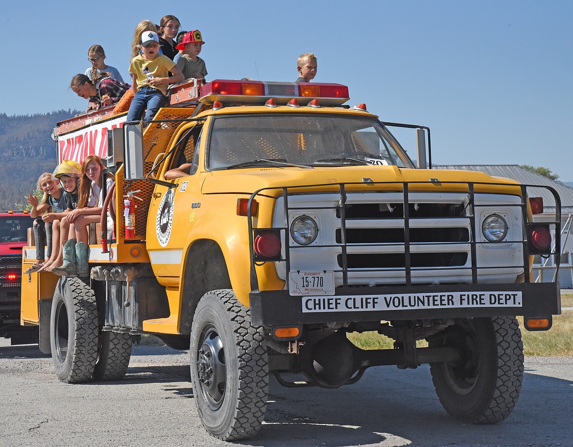 Kids have fun riding aboard a Chief Cliff fire truck in the Dayton Daze parade. (Marla Hall/Lake County Leader)