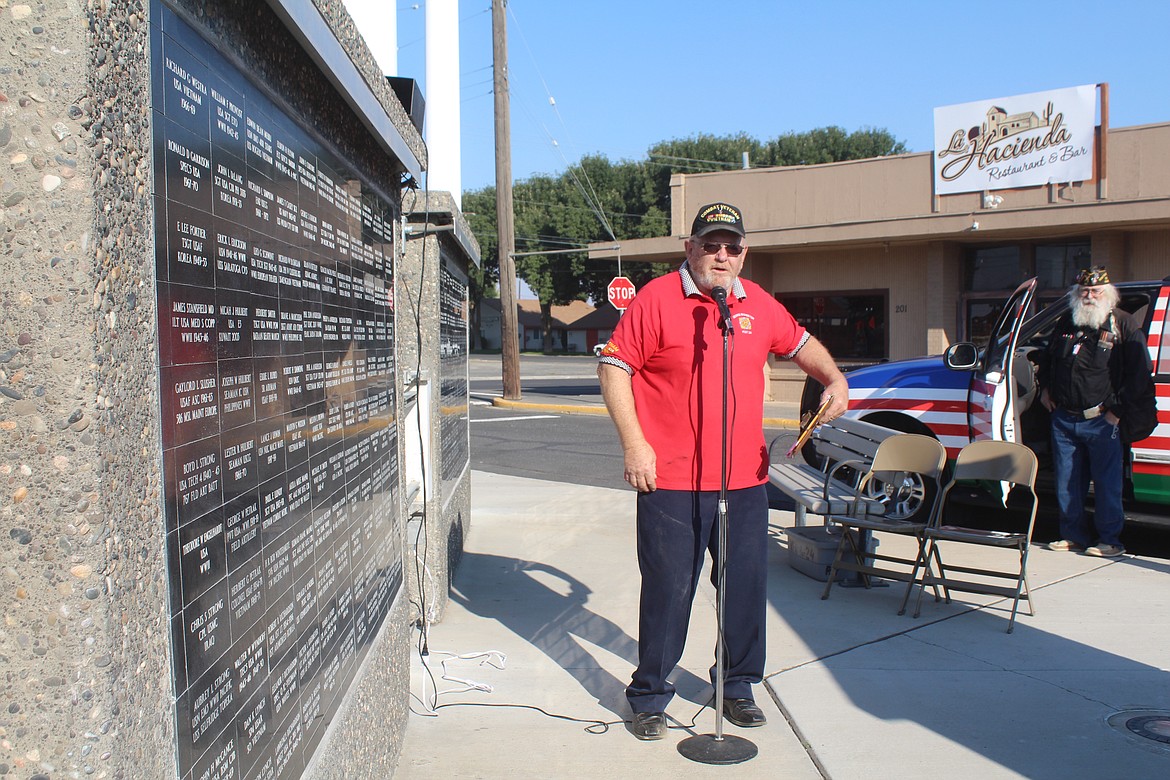 Phil Anderson (foreground) talks about the Veterans Recognition Wall. Mark Owens, who with his dad R. Judge Owens came up with the idea, is in the background.