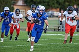Gridders thrash Ronan in home opener