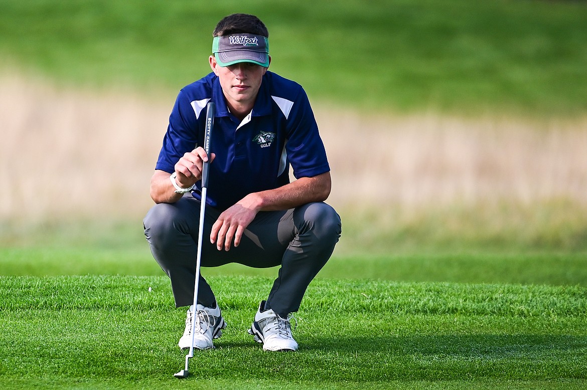 Glacier's Tyler Avery sizes up a putt on the 9th green during the Kalispell Invite at Northern Pines Golf Club on Wednesday, Sept. 14. (Casey Kreider/Daily Inter Lake)