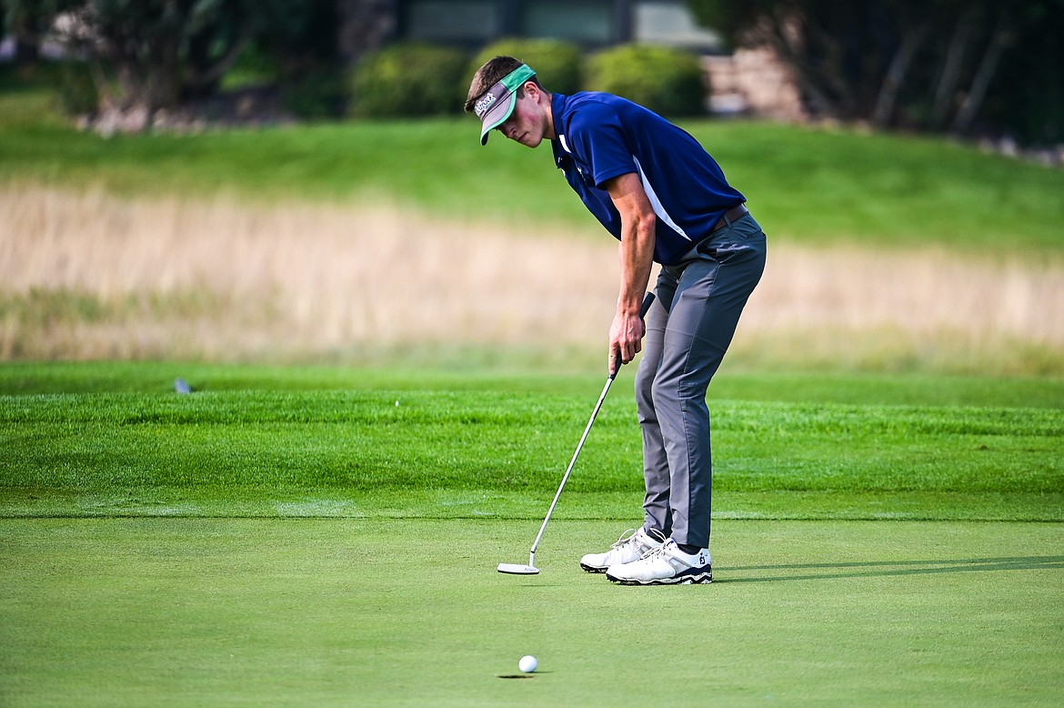 Glacier's Tyler Avery sinks a putt on the 9th green during the Kalispell Invite at Northern Pines Golf Club on Wednesday, Sept. 14. (Casey Kreider/Daily Inter Lake)