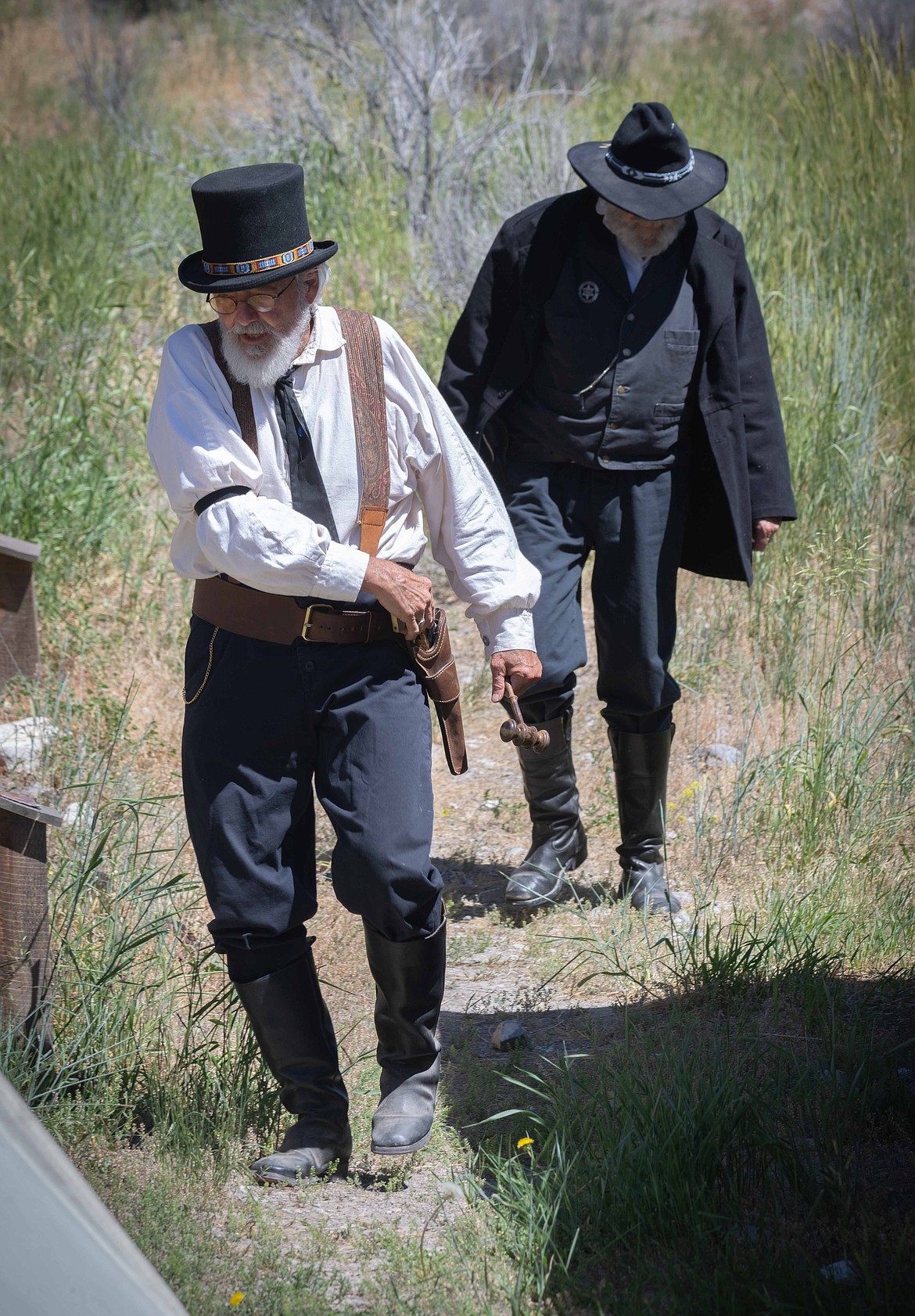 Judge Allen Williams from Wallace chases down an escaped criminal during a reenactment at Bannack State Park. (Tracy Scott/Valley Press)