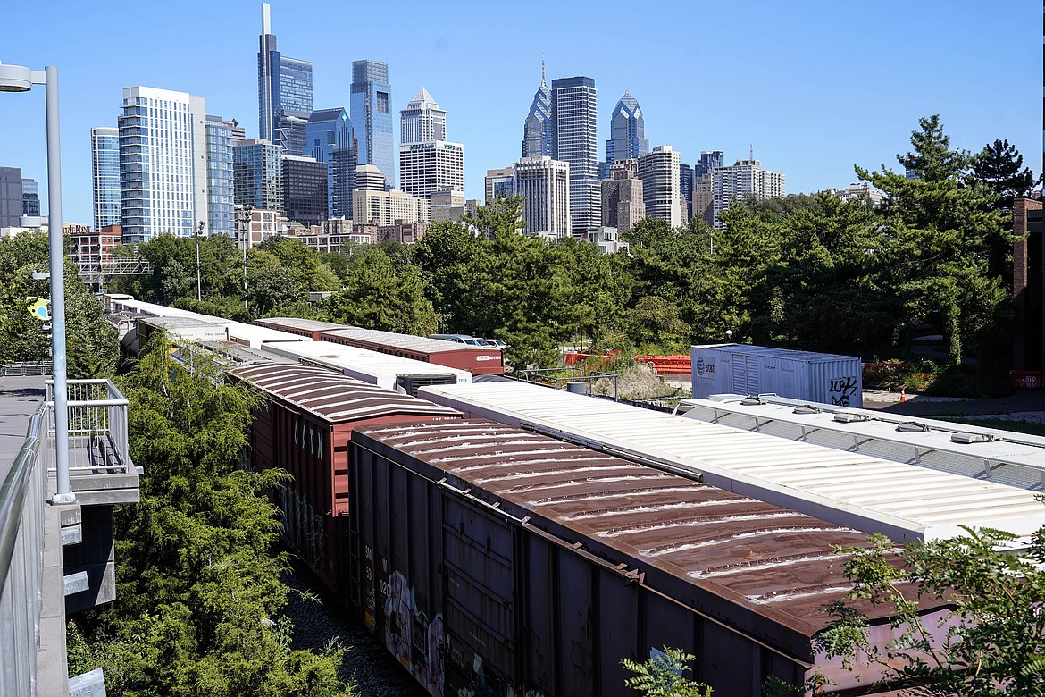 Freight train cars sit idle on tracks in Philadelphia, Wednesday, Sept. 14, 2022. President Joe Biden said Thursday that a tentative railway labor agreement has been reached, averting a strike that could have been devastating to the economy before the pivotal midterm elections. (AP Photo/Matt Rourke)