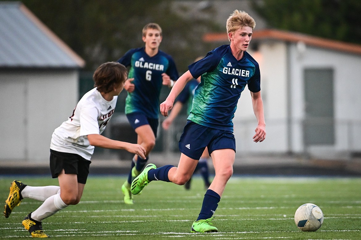 Glacier's Liam Ells (11) pushes the ball upfield against Flathead at Legends Stadium on Thursday, Sept. 15. (Casey Kreider/Daily Inter Lake)