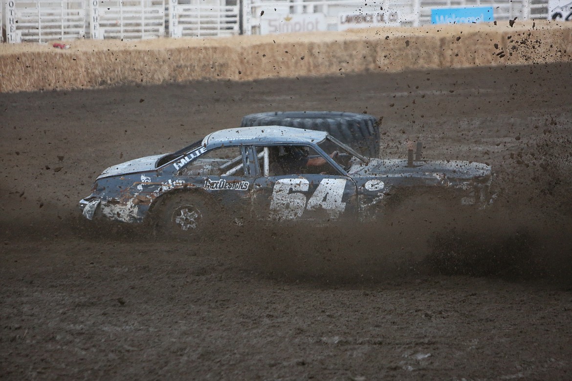 Dust and dirt were kicked up by cars while making sharp turns, sometimes sending dirt into the spectator stands.