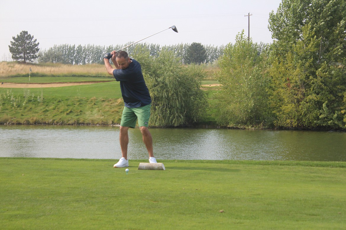 Nic Vela at the top of the backswing while teeing off at the ninth hole at the Samaritan Foundation Desert Golf Classic.