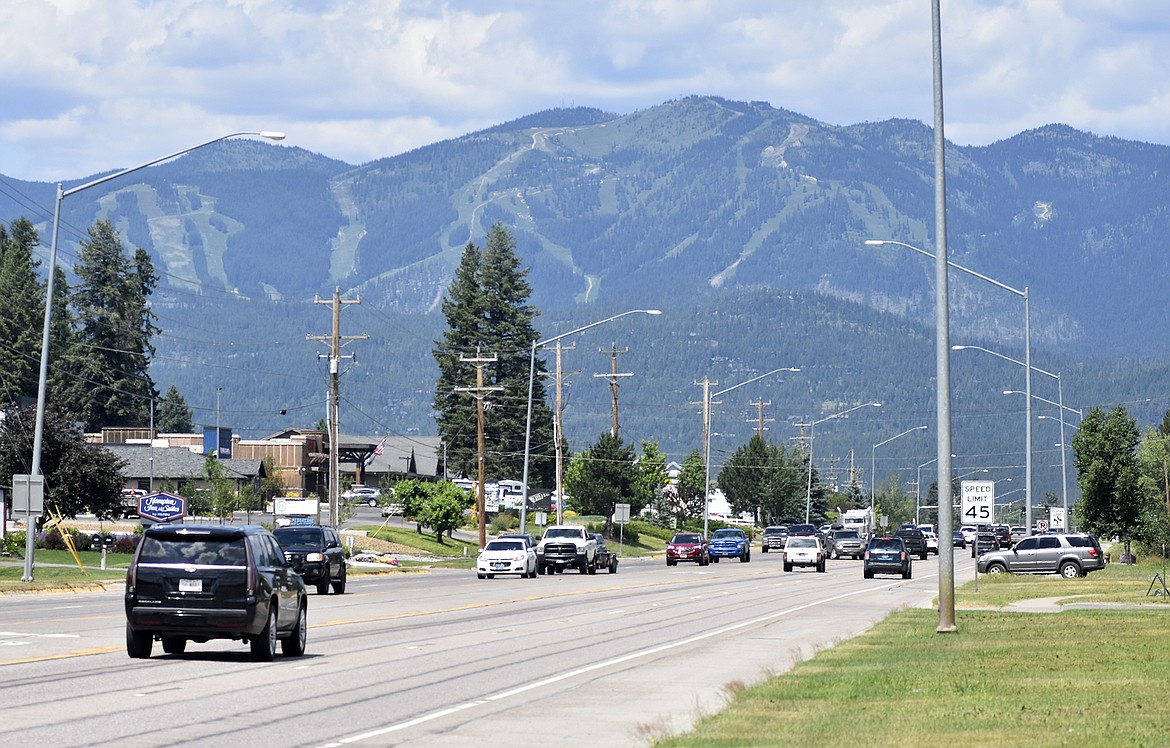 Cars drive along U.S. Highway 93 in Whitefish. (Heidi Desch/Daily Inter Lake file)