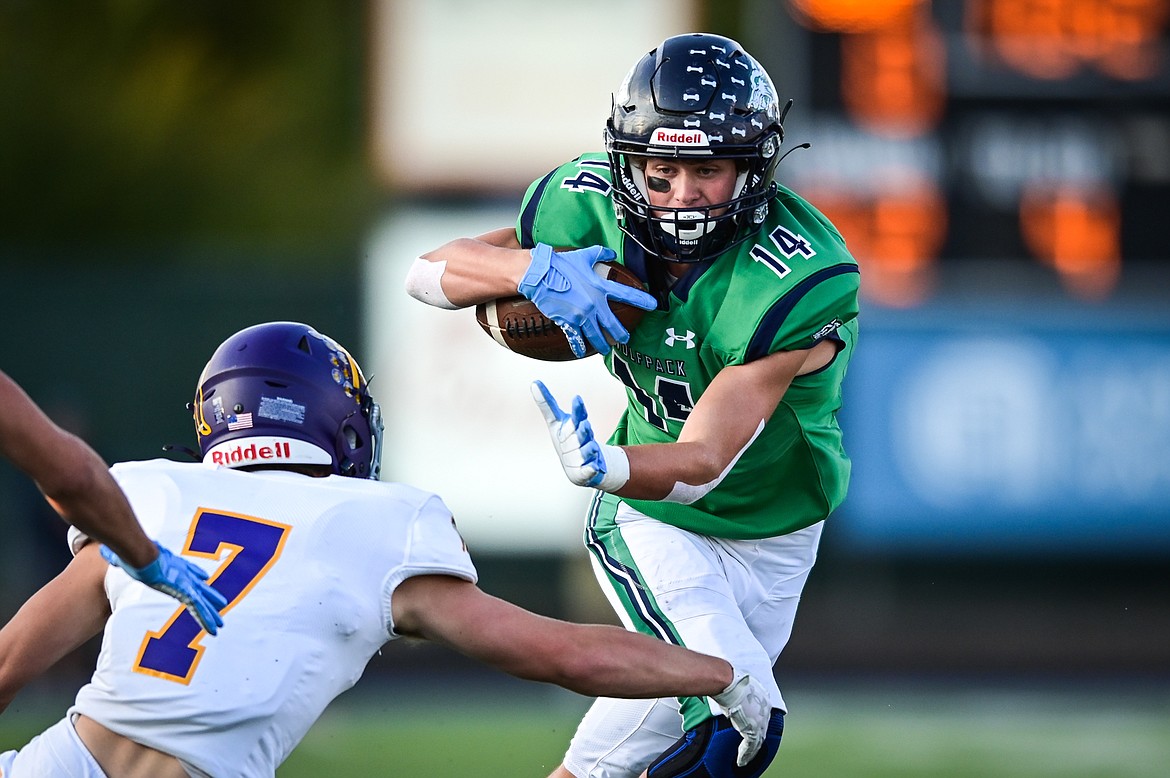 Glacier wide receiver Kaid Buls (14) picks up yardage after a reception in the first quarter against Missoula Sentinel at Legends Stadium on Friday, Sept. 16. (Casey Kreider/Daily Inter Lake)