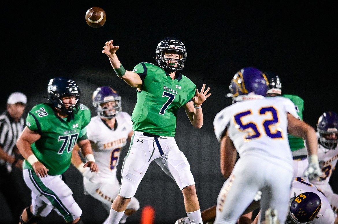 Glacier quarterback Gage Sliter (7) completes a pass to Kaid Buls for a first down on a key fourth down in the fourth quarter against Missoula Sentinel at Legends Stadium on Friday, Sept. 16. (Casey Kreider/Daily Inter Lake)