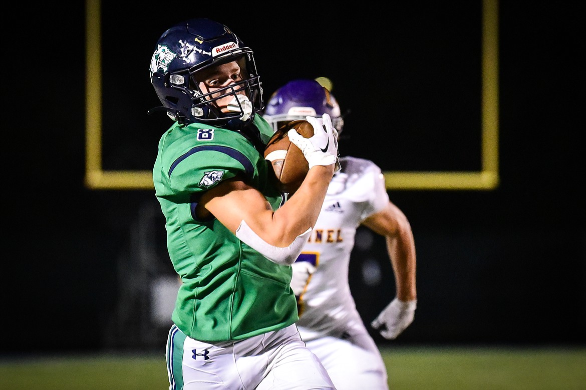 Glacier wide receiver Evan Barnes (8) hangs on to a reception along the sideline in the third quarter against Missoula Sentinel at Legends Stadium on Friday, Sept. 16. (Casey Kreider/Daily Inter Lake)