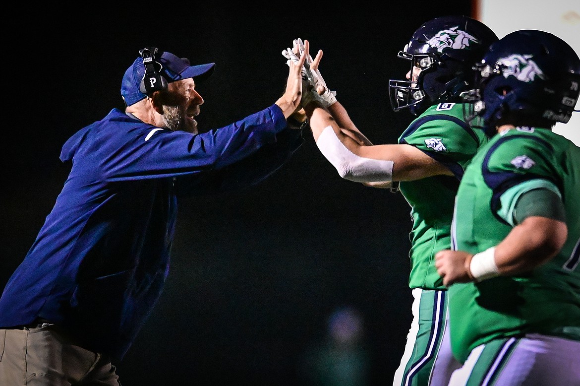 Glacier head coach Grady Bennett congratulates running back Kash Goicoechea (6) after Goicoechea's 16-yard touchdown run in the third quarter against Missoula Sentinel at Legends Stadium on Friday, Sept. 16. (Casey Kreider/Daily Inter Lake)