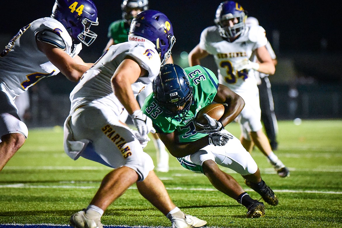 Glacier running back Kobe Dorcheus (33) scores a touchdown on a run in the fourth quarter against Missoula Sentinel at Legends Stadium on Friday, Sept. 16. (Casey Kreider/Daily Inter Lake)