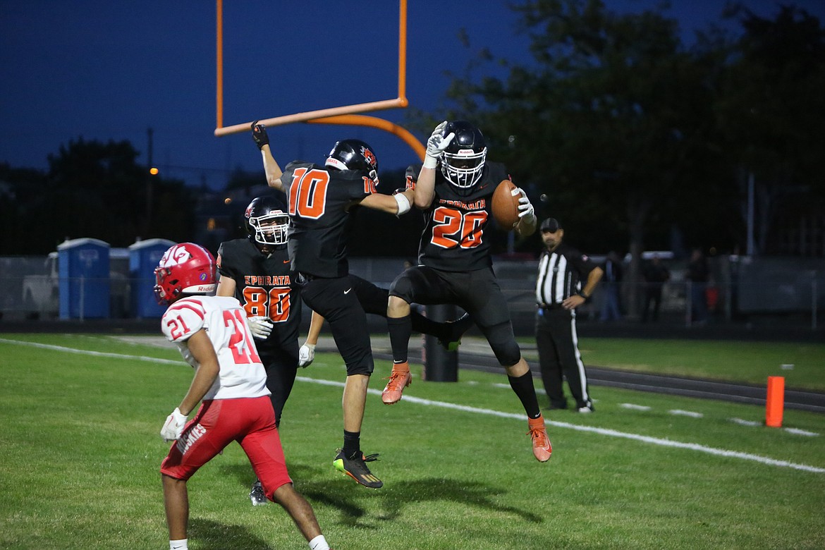 Ephrata teammates Joshua Green (10) and Hudson Sager (20) celebrate after Sager scores a touchdown in the second quarter on Friday.