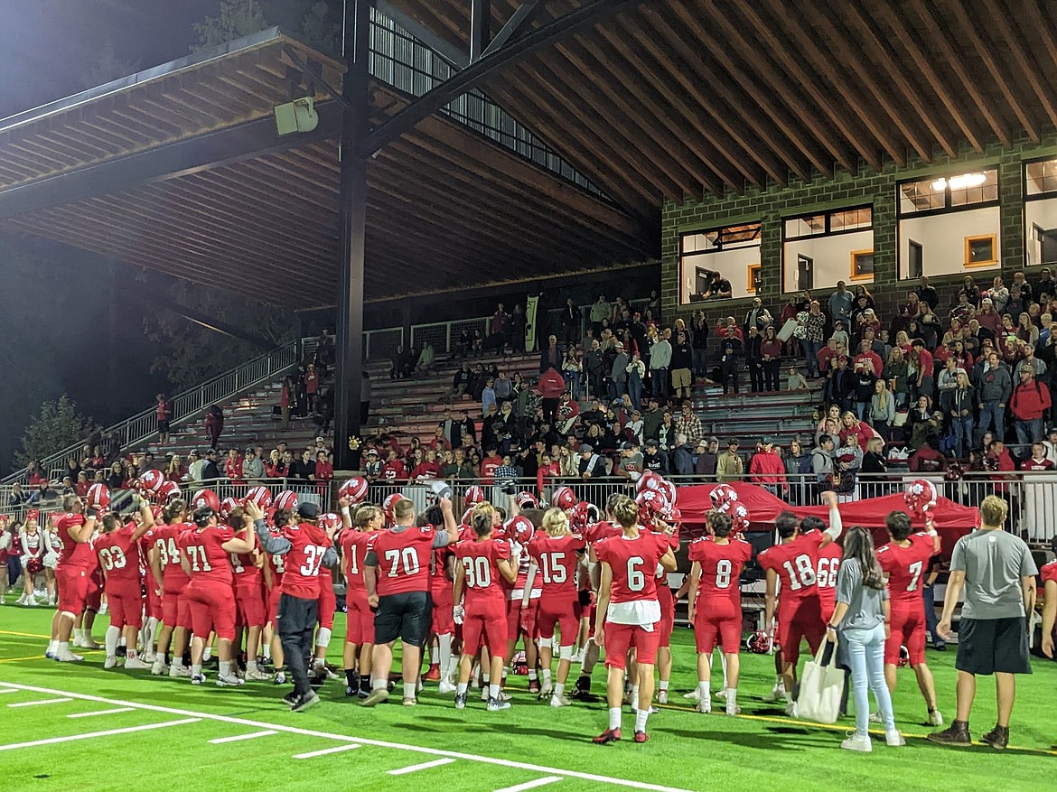 Players celebrate and thank the community for their support after their 28-21 win against the Homedale Trojans Friday night. The Bulldogs worked hard in the second half to keep the Homedale players at bay.