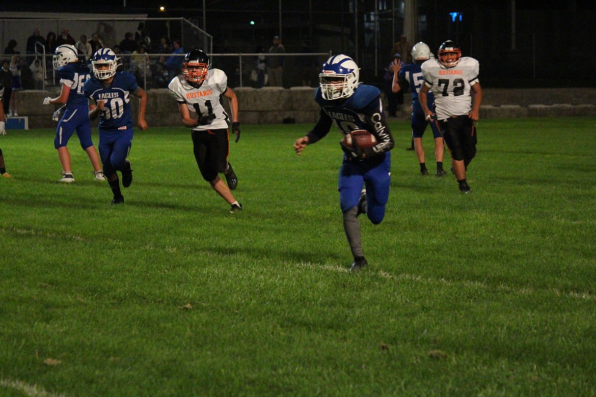 Eagles running back Robby Fisher (10) breaks into the open field during the Soap Lake-Bridgeport game.