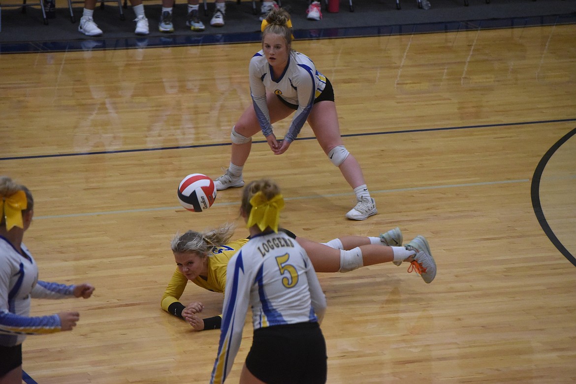 Libby's Kinzee Boehmler dives for a ball at Thursday's volleyball match against Whitefish. (Scott Shindledecker/The Western News)