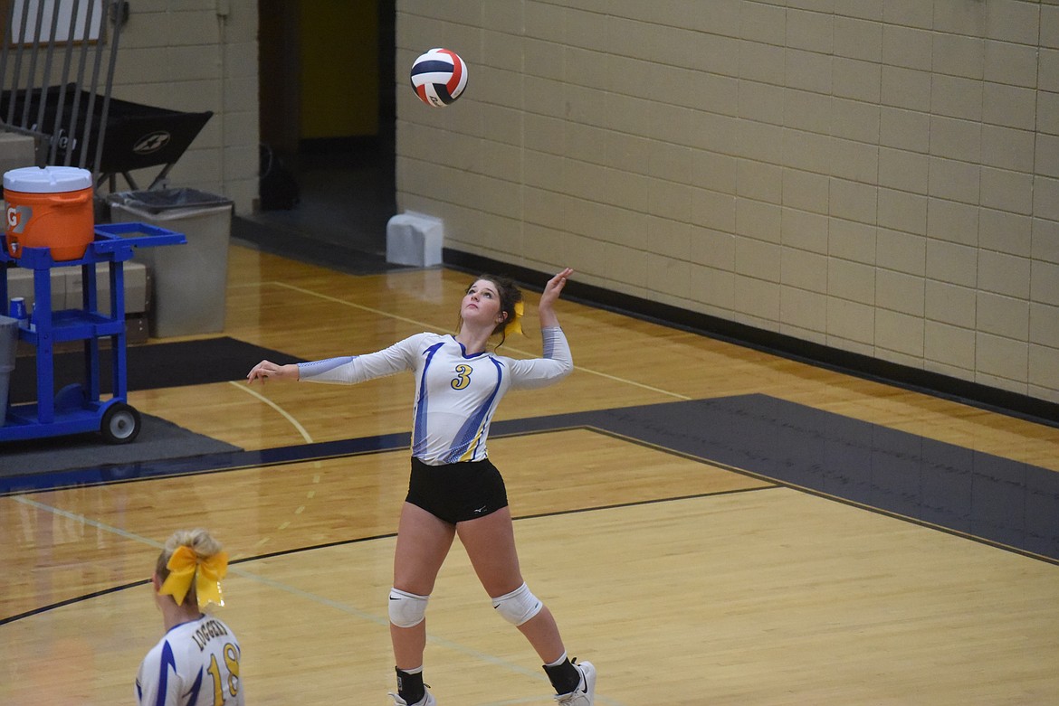 Libby's Molly Gotham serves at Thursday's volleyball match against Whitefish. (Scott Shindledecker/The Western News)