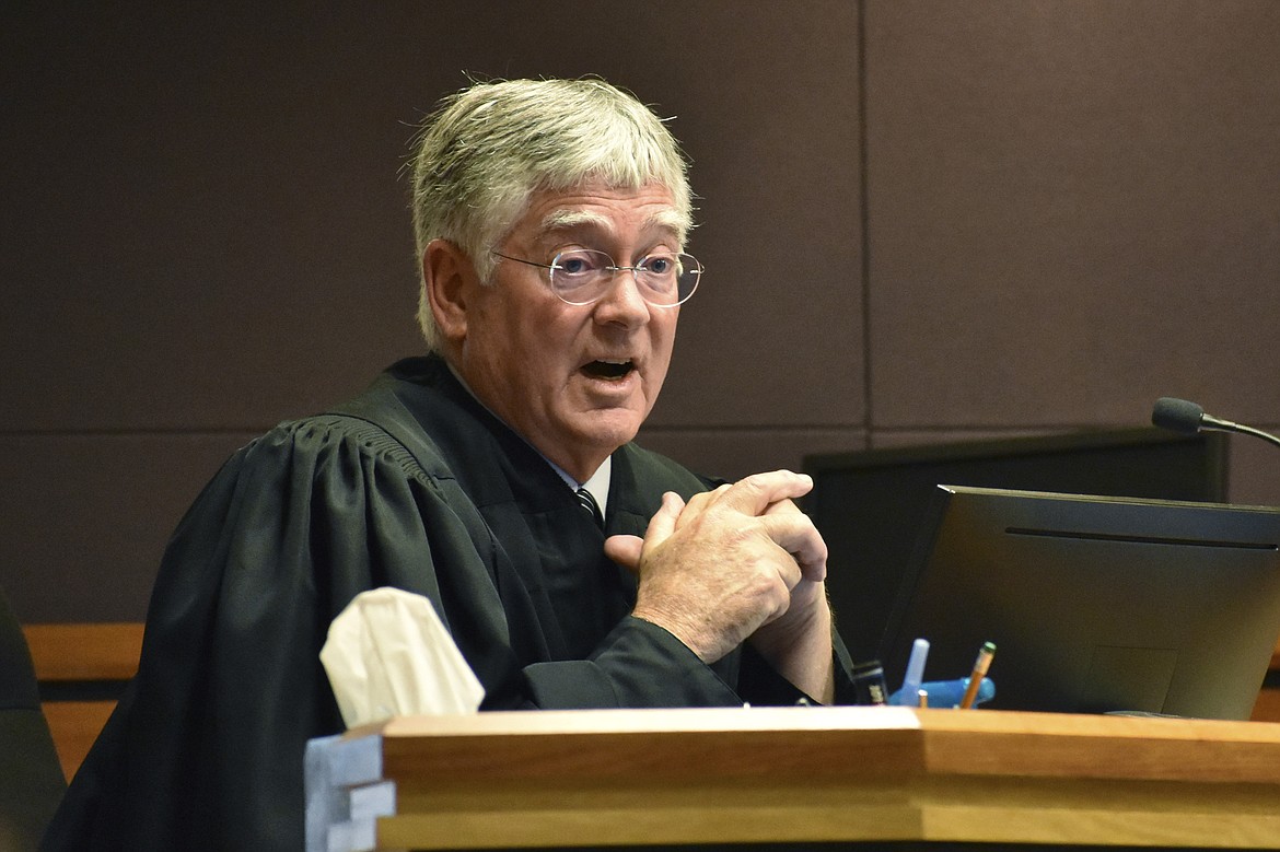 Montana District Judge Michael Moses speaks to attorneys during a court hearing on birth certificate changes for transgender people, on Sept 15, 2022, in Billings, Mont. Moses said in a Monday, Sept. 19, 2022, order that state health officials were being "demonstrably ridiculous" as they repeatedly refused to follow his orders to stop enforcing a state rule that would prevent transgender people from changing the gender on their birth certificate. (AP Photo/Matthew Brown)