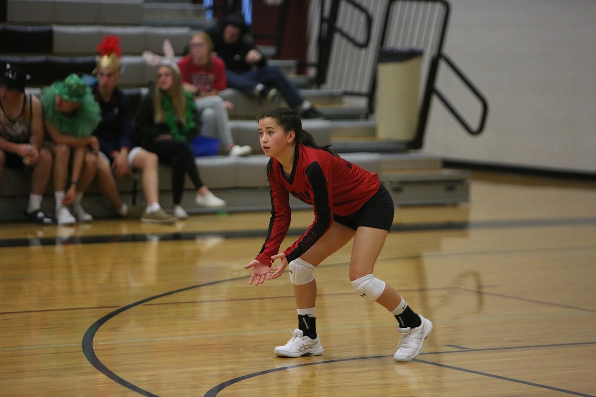 ACH junior libero Beth Okamoto awaits a Wellpinit serve during the Warriors’ 3-0 win on Thursday.