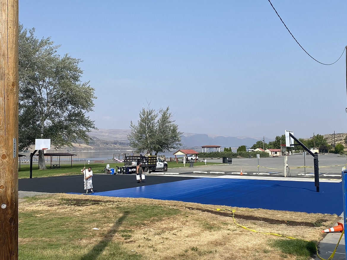 Over the weekend, the final touches were added to the new basketball court at Smokiam Park. The court was painted blue and orange to match the city’s official color palette and the Soap Lake School District color.