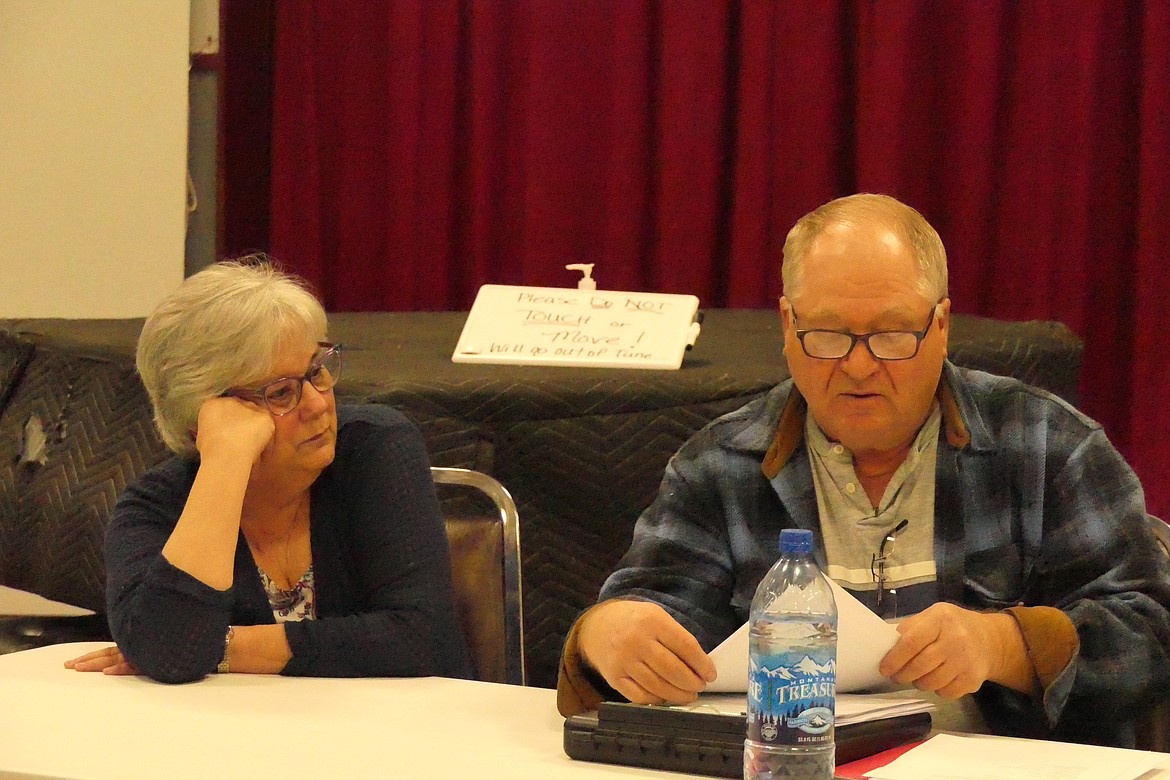 Former Paradise Sewer Board member Janice Barber listens while current PSB member Terry Caldwell goes over documents at a board meeting earlier this year. (Chuck Bandel/VP-MI)