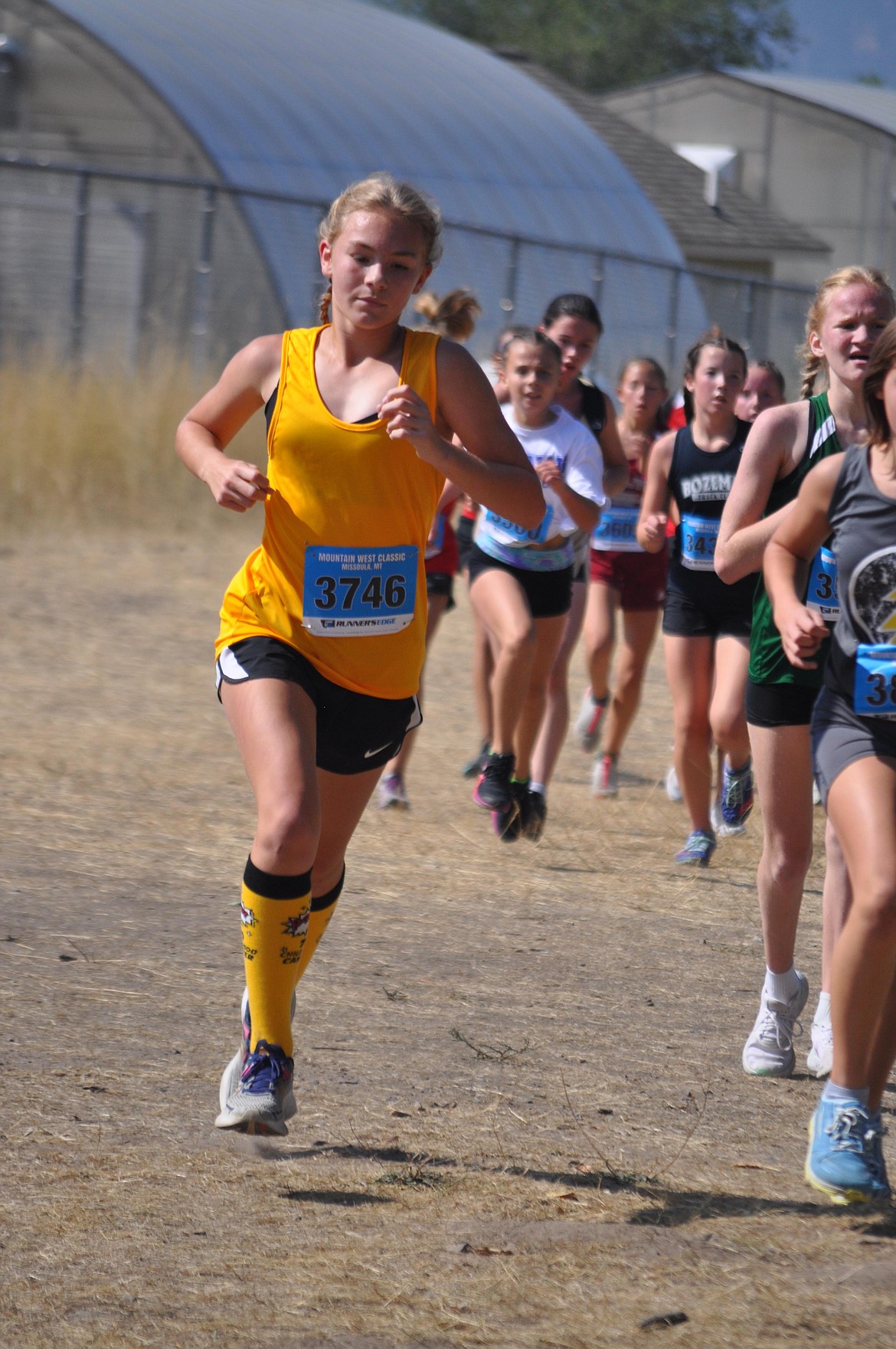 Thompson Falls runner Lexy Franck runs in the Mountain West Classic cross country meet this past Saturday in Missoula. (Photo by Sarah Naegeli)