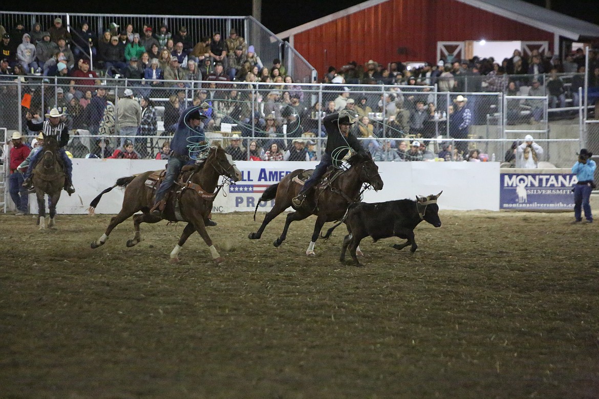 Team ropers chase after a steer during the Othello PRCA Rodeo on Sept. 17, 2022.