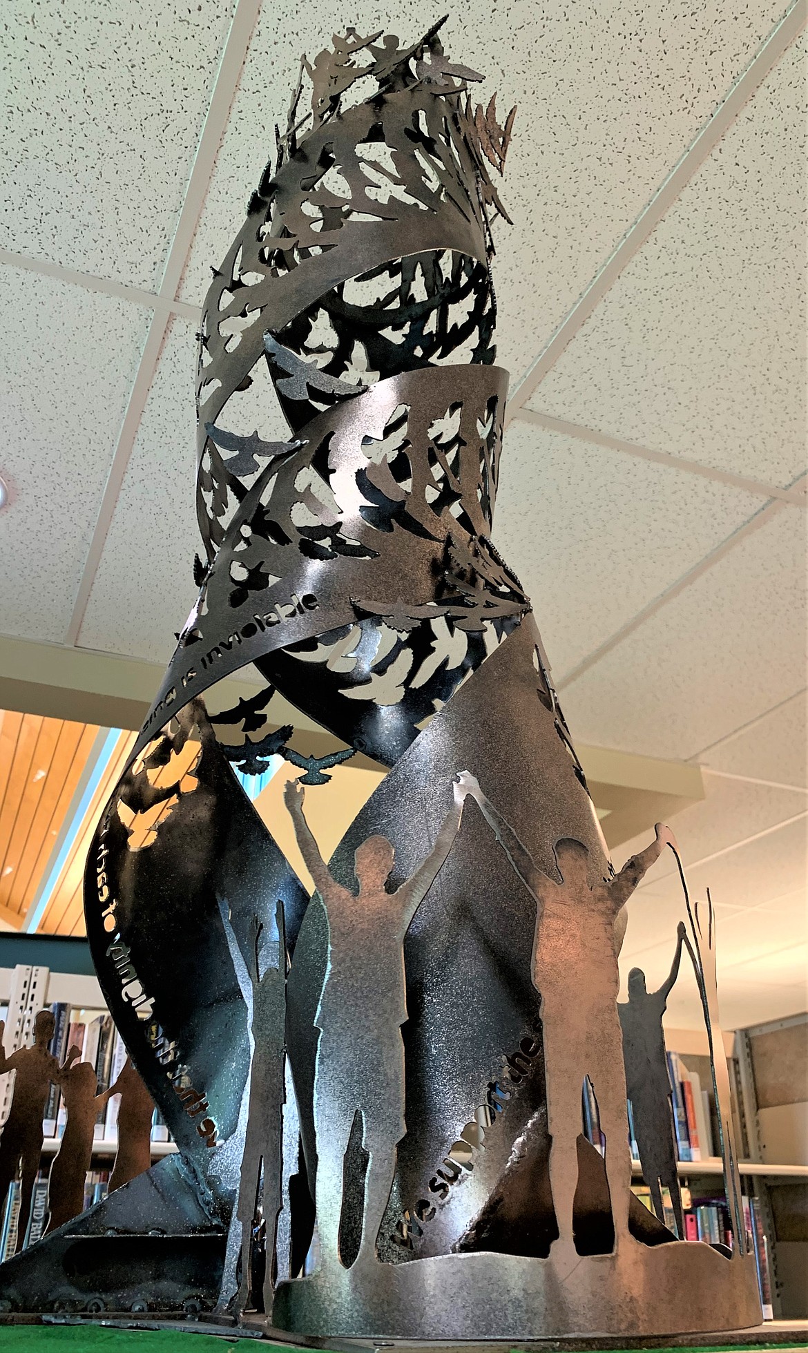 A model of “The Monument to Peace and Unity” is displayed in the Coeur d'Alene Public Library.  A dedication ceremony is set for Friday at the Four Corners intersection of Northwest Boulevard, Government Way, and Fort Grounds Drive.